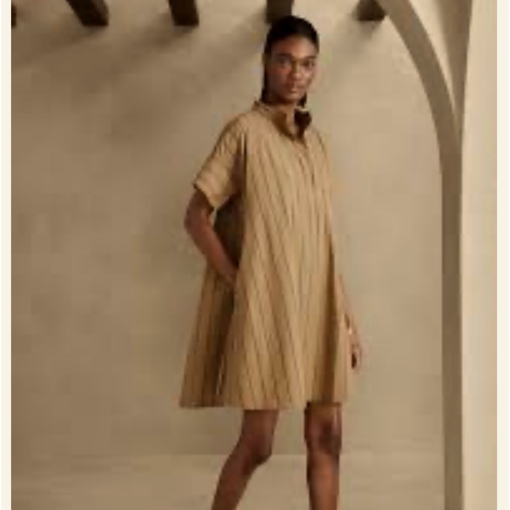 Khaki and black pinstripe swing dress with pockets.